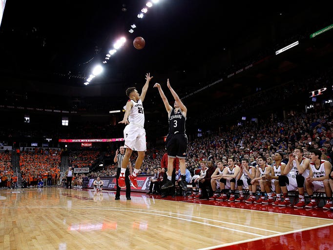 Cedarburg's John Diener shoots over La Crosse Central's