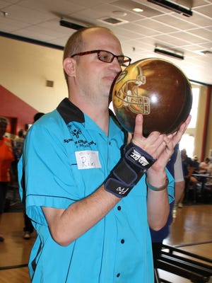 Deming Roadrunner Riley Tolman sizes up a strike during Saturday's New Mexico Special Olympics Regional Bowling Tournament at the Starmax Bowling Center. Athletes were qualifying for state competition that will be held Oct. 3-31 in Las Cruces.