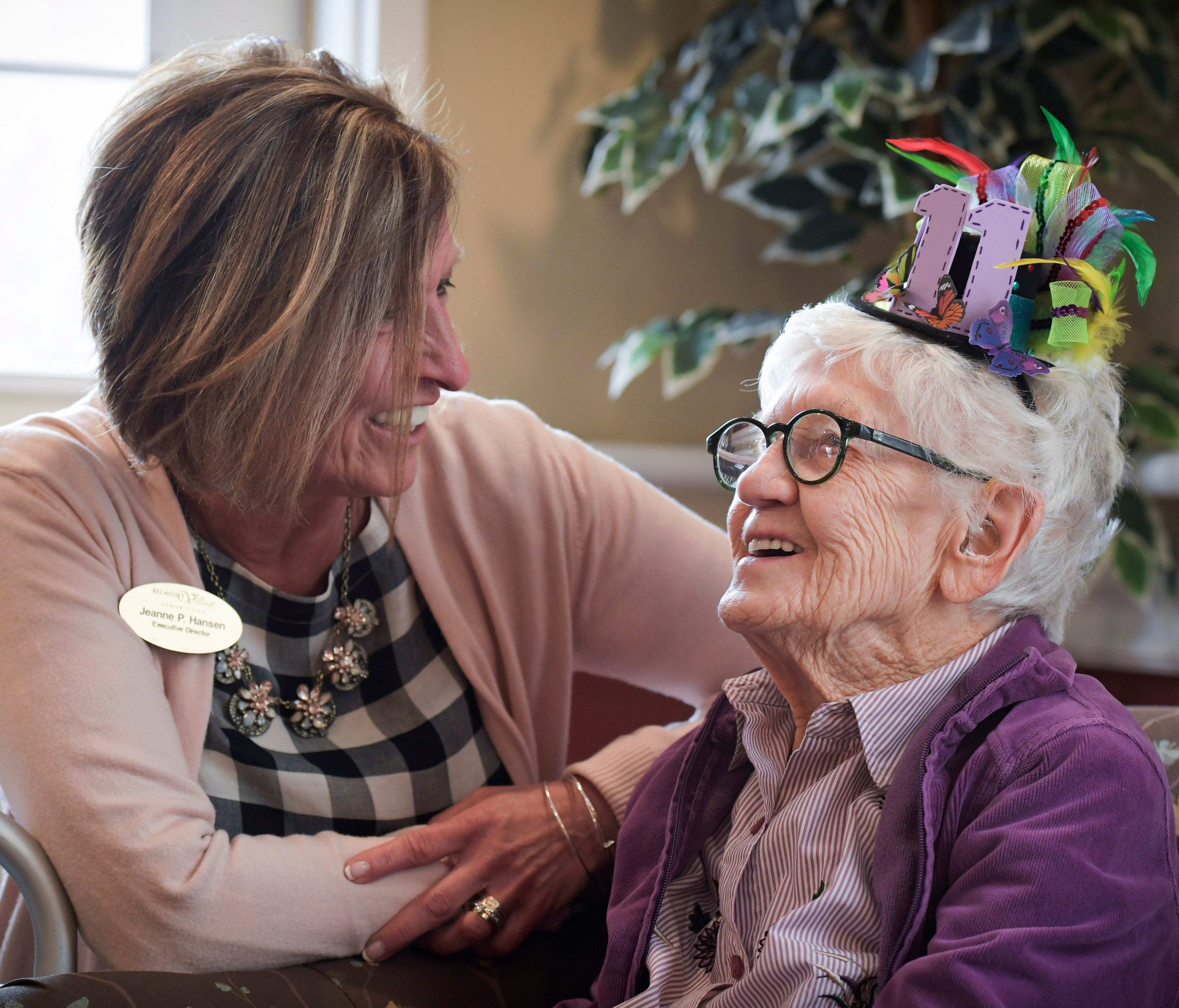 Belmont Village Executive Director Jeanne Hansen chats with Merle Phillips as Phillips celebrates her 111th birthday at the retirement community in Carol Stream, Ill. Monday, April 2, 2018.
