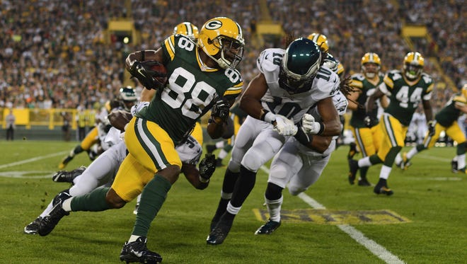 Green Bay Packers wide receiver Ty Montgomery (88) runs to the outside while pursued by Philadelphia Eagles wide receiver Quron Pratt (10) in the first quarter. The Green Bay Packers hosted the Philadelphia Eagles in a preseason game at Lambeau Field in Green Bay, Wis. on Saturday, Aug. 29, 2015.