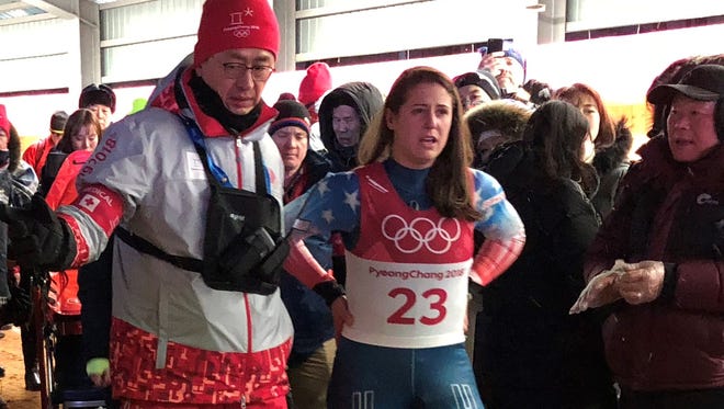 American Emily Sweeney was examined by medical personnel after her luge crash.
