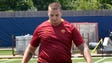 Michigan offensive lineman Mason Cole dribbles a soccer