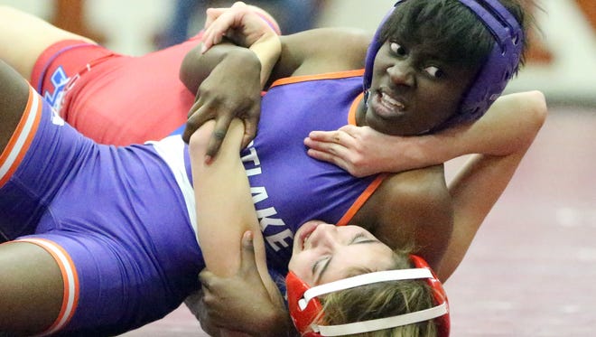 Danielle Spann, top, of Eastlake takes the upper hand against Sabrina Aguilera of Bel Air during their 98-pound match at the District 2-5A Wrestling Tournament Saturday at Riverside High School. Spann managed to pin Aguilera for the win.