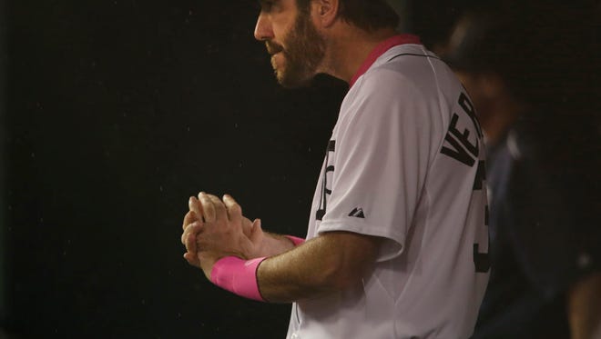 Tigers pitcher Justin Verlander watches the action from the dugout  between the Detroit Tigers and the Kansas City Royals.