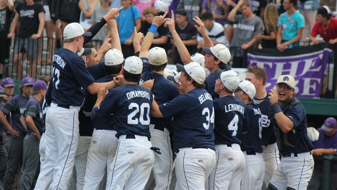 Grosse Pointe South celebrates its first state baseball championship since 2001, beating Woodhaven, 8-1 at Michigan State University on Saturday, June 16, 2018.