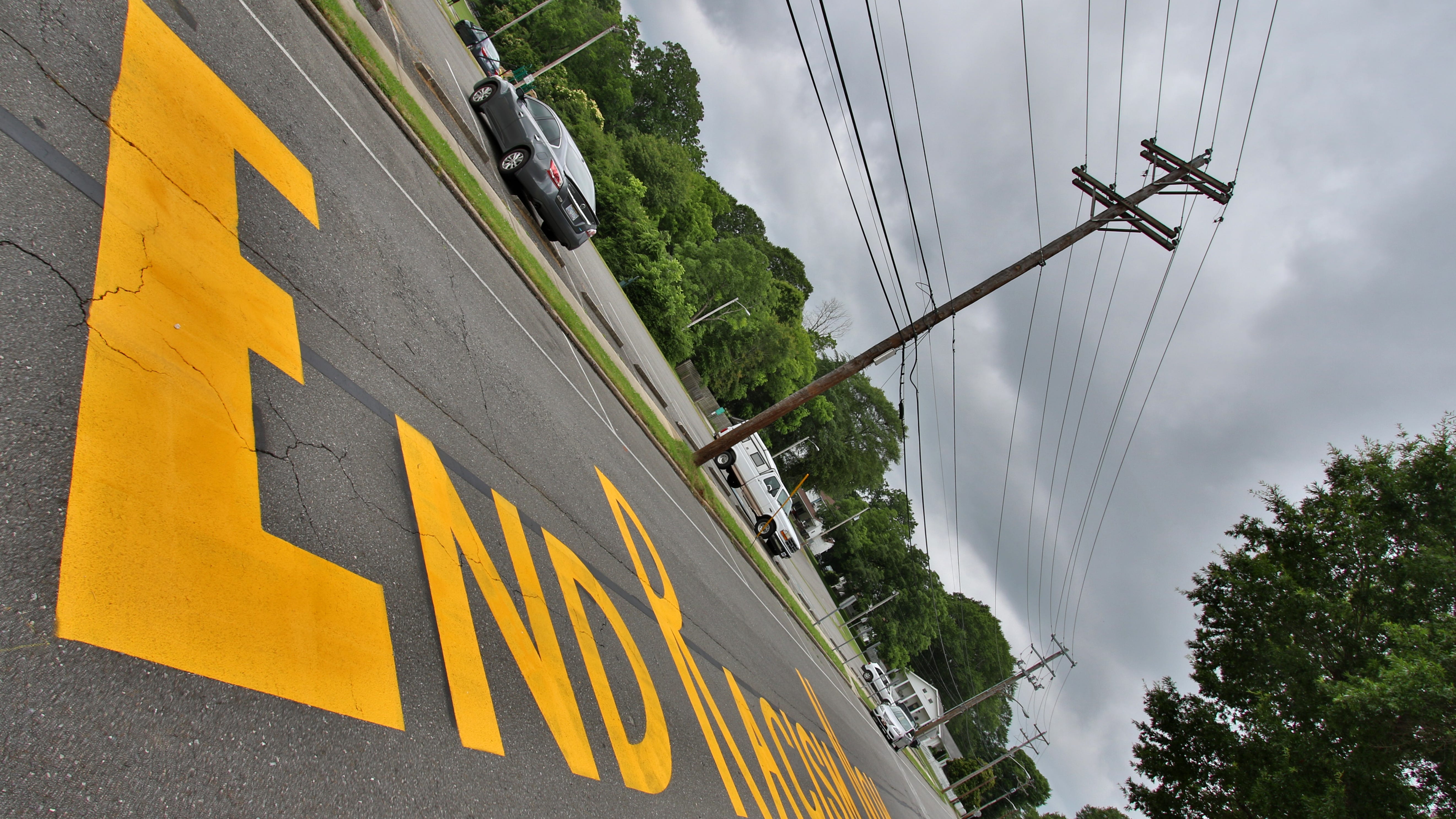 The phrase &ldquo;End Racism Now&rdquo; painted on West Church Street in Dallas Monday morning, June 22, 2020.