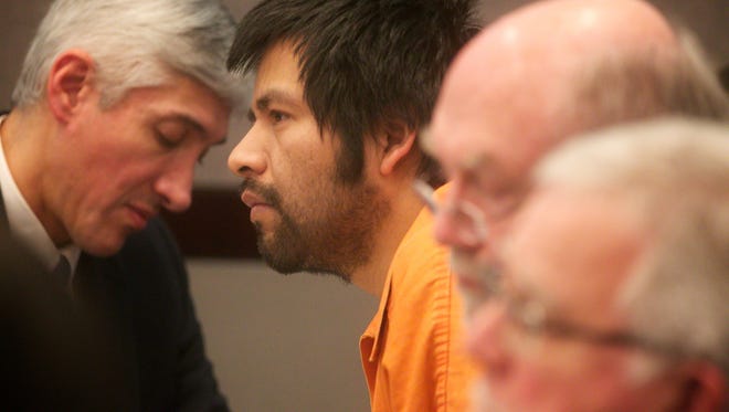 Eloy Vasquez-Santiago sits in court during hi trial on Tuesday, March 17, 2015, in Portland, Ore. Vasquez-Santiago is on trail after being charged with killing a Hillsboro mother of six in August 2012. Vasquez-Santiago's case has garnered extra media attention because his father has been held in jail as a material witness for more than 900 days and his brother was held for more than 700 days before giving a video deposition. (AP Photo/The Oregonian, Benjamin Brink)