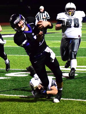CHCA quarterback Danny Vanatsky breaks a tackle on a keeper against Blanchester.