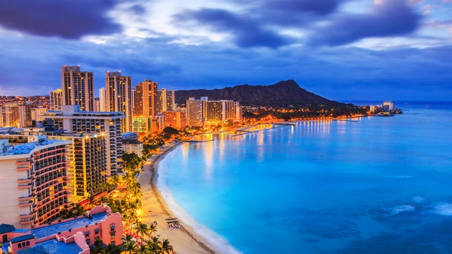 Honolulu's skyline and oceanfront seen at night.