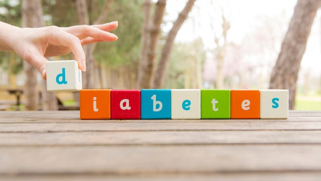 The word "diabetes" spelled out with wooden letter blocks