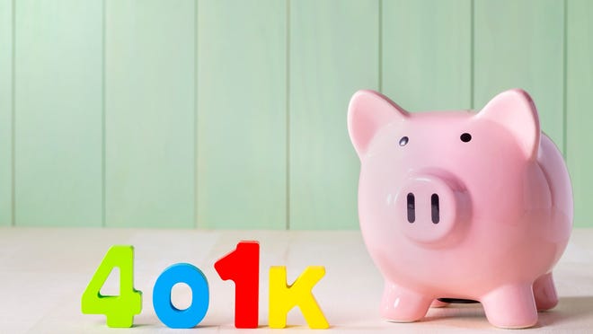401(k) written in colorful letters next to a piggy bank.