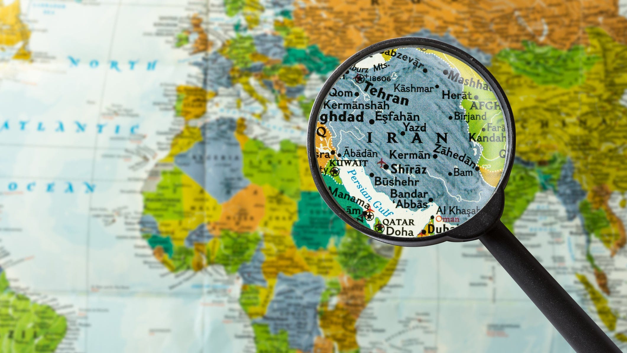 Map of Iran under a magnifying glass