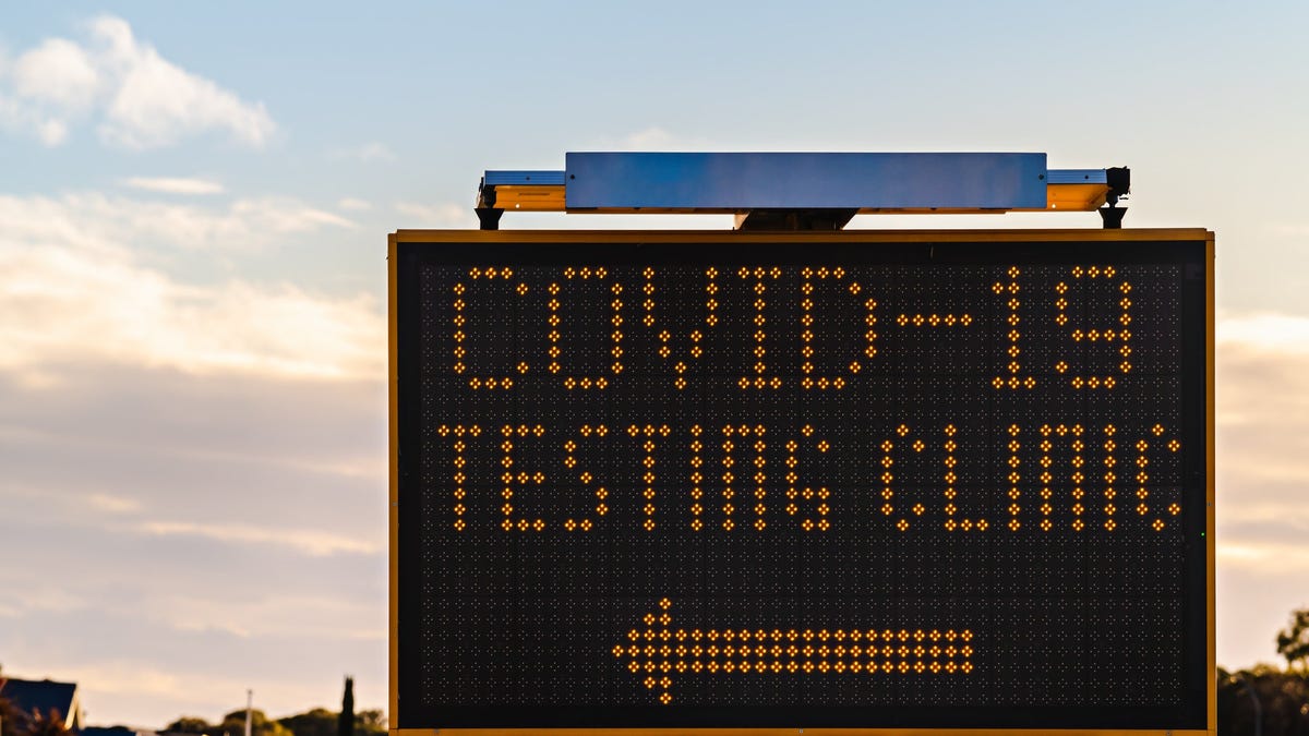 A sign gives directions to the nearest COVID-19 testing clinic.
