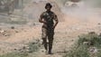 A member of the Iraqi forces takes position in the