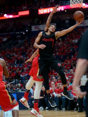 Portland Trail Blazers guard CJ McCollum (3) drives to the basket during the second half of Game 3 of a first-round NBA basketball playoff series against the New Orleans Pelicans in New Orleans, Thursday, April 19, 2018. (AP Photo/Veronica Dominach)