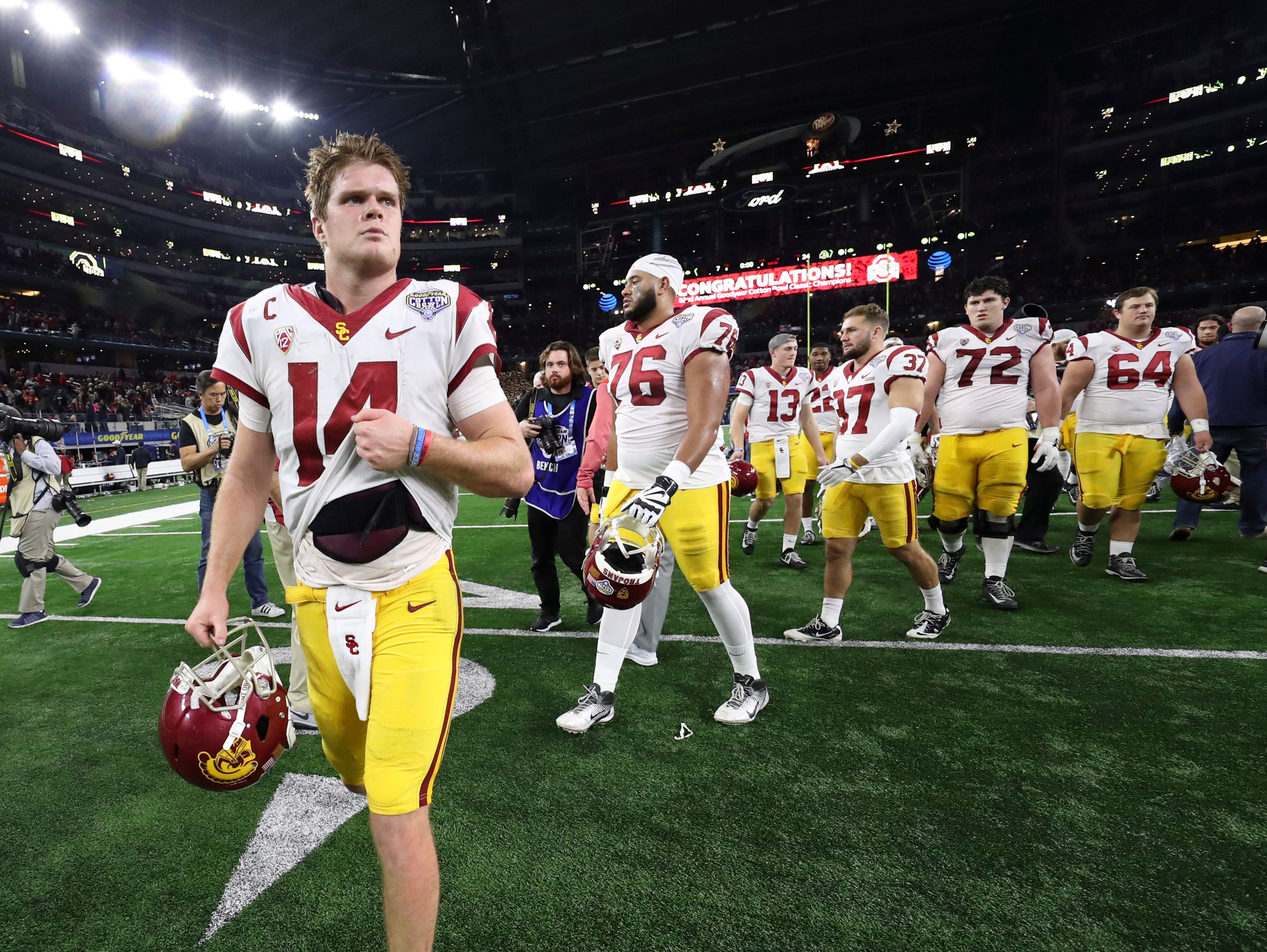Quarterback Sam Darnold and the USC Trojans depart after losing to Ohio State in the Cotton Bowl.