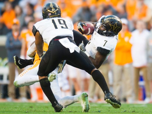 Vanderbilt running back Ralph Webb (7) gets tackled
