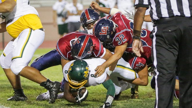 Kavon Fulgham stopped behind the line of scrimmage. The La Quinta varsity football team won Friday's home non-conference game against Notre Dame (Riverside, CA) by a score of 28-10.