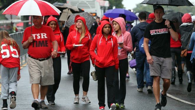 Rutgers is hosting Penn State at 8 p.m. in the most anticipated football game in school history, the first ever Big Ten game on campus.

Fans for both teams descended on the parking lots at HighPoints Solution Stadium in Piscataway for pre game celebrations.

Despite the steady rain fall fans walk around the parking lots before the start of the game.
On Saturday September 13,2014
Photo: Mark R. Sullivan/Staff Photographer