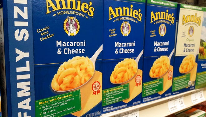 Boxes of Annie's Macaroni & Cheese are shown on the shelf at a supermarket in Edina, Minn., Sunday, March 4, 2018. Annie's is an organic and natural unit of food industry giant General Mills, which announced a deal Tuesday to create a 34,000-acre organic farm in South Dakota to supply it with organic wheat that will become pasta for the popular product. (AP Photo/Steve Karnowski)