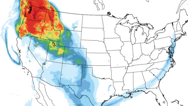 A combination of high and low pressure systems has resulted in smoke from wildfires in the Pacific Northwest being directed into New Mexico. This NOAA map forecasts the thickness of smoke in the atmosphere around midnight Wednesday, with red and orange areas being the thickest and light blue areas being the thinnest.