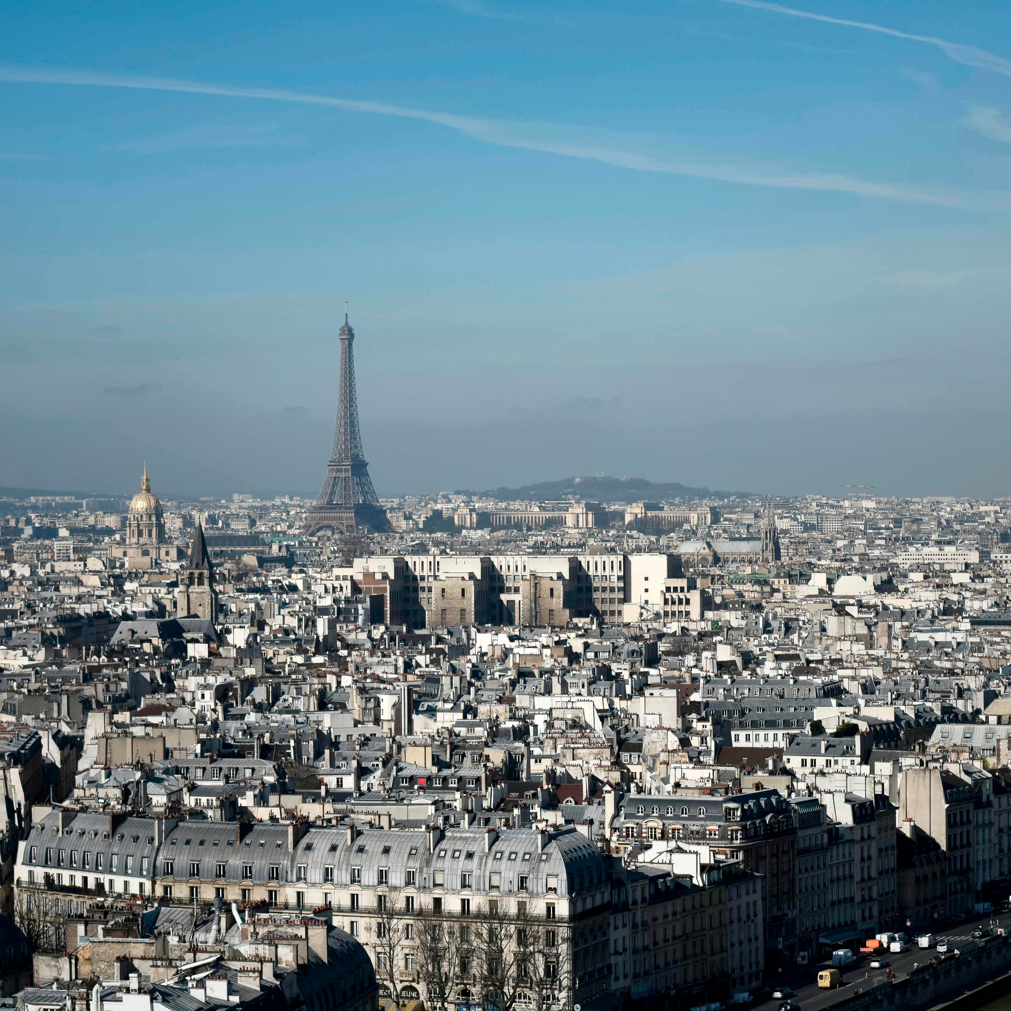 The Eiffel Tower and the dome of Les Invalides, are seen along the skyline of Paris.