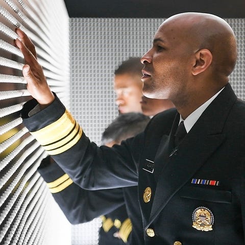 Surgeon General Jerome Adams touching "The Pill...