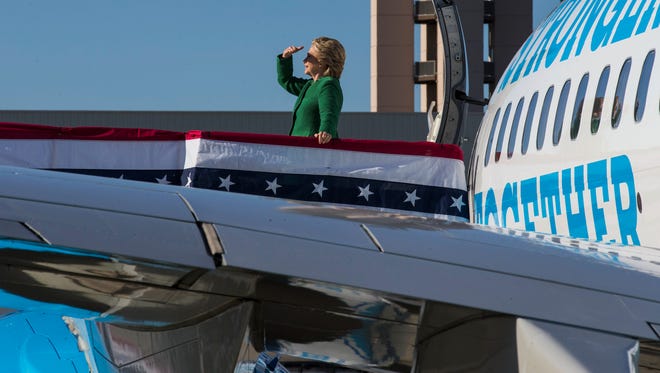 Hillary Clinton looks back before boarding her campaign plane after a rally in Raleigh, N.C., Oct. 23, 2016. Democrats must gain 30 seats to capture a majority in the House: That requires sweeping nearly all Republican-held seats in which they nurse even small hopes of winning. (Ruth Fremson/The New York Times)