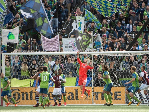 Seattle Sounders goalkeeper Stefan Frei (24) punches