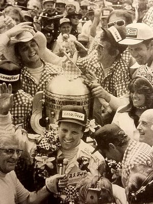 A.J. Foyt celebrates his fourth Indianapolis win in 1977. From he exhibit, "A.J. Foyt: A Legendary Exhibition" at the Gilmore Car Museum in Hickory Corners.