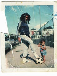 Bob Marley in the fall of 1976 in front of his house