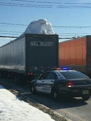 South Brunswick police stopped a truck with a pile of snow on top.