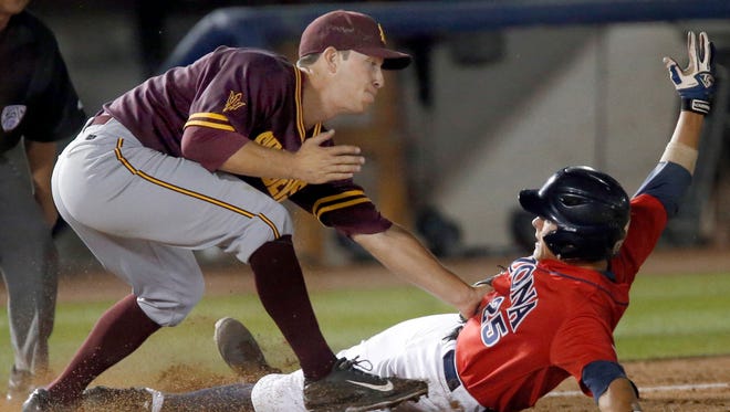 Arizona's Scott Kingery is tagged out by Arizona State third baseman David Greer during the second inning of their game at Hi Corbett Field in Tucson on Wednesday.