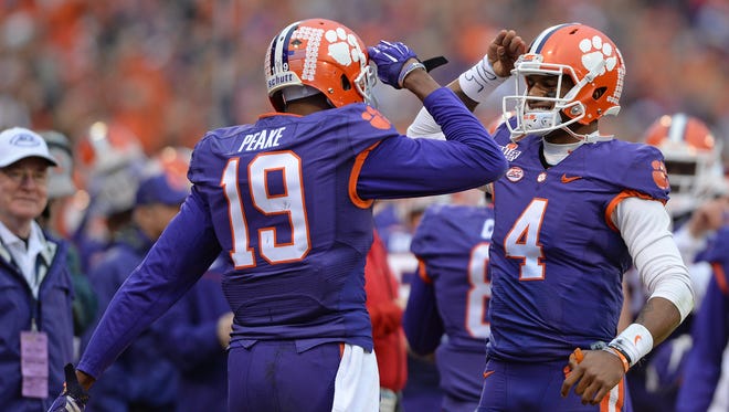 Clemson wide receiver Charone Peake (19) salutes quarterback Deshaun Watson (4) after the two connected on a 45 yard TD against Wake Forest during the 1st quarter Saturday, November 21, 2015 at Clemson's Memorial Stadium. 