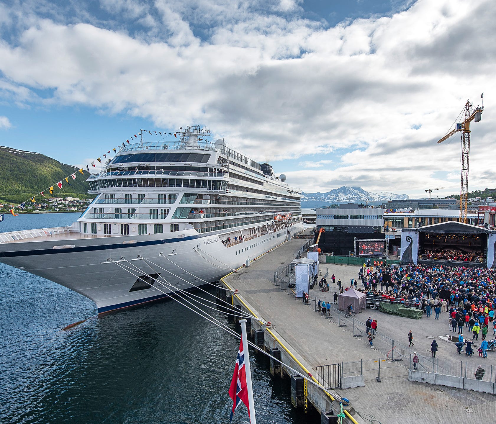 A crowd gathers along the waterfront of Tromso, Norway on June 22, 2017 for the christening of Viking Ocean Cruises' newest ship, Viking Sky.
