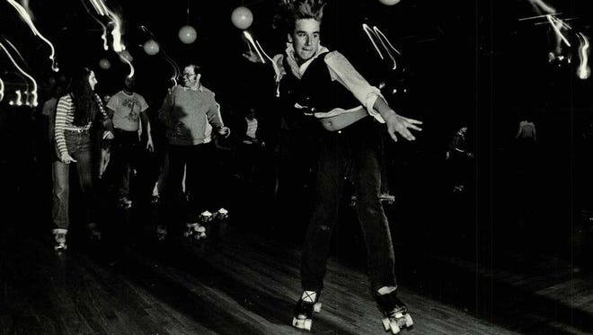 Dave Maroulis, a rink guard at United Skates of America, demonstrates his skills in this 1980 file photo.