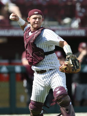 Mississippi State's Dustin Skelton (8) throws out a runner at first. Mississippi State played Vanderbilt in an SEC college baseball game on Saturday, March 17, 2018. Photo by Keith Warren