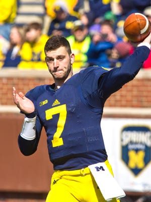 Michigan quarterback Shane Morris throws passes to warm up for the  spring game in Ann Arbor on April 4, 2015.