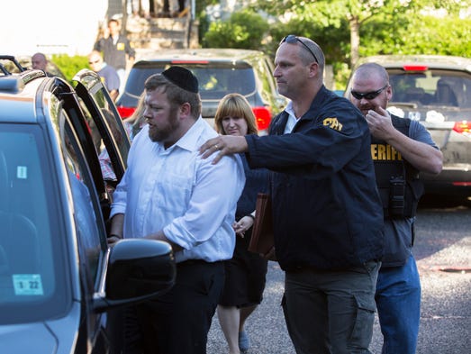 Shimi (left) and Yocheved (behind) Nussbaum were arrested