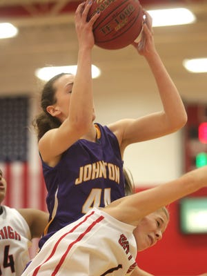 Johnston's Taryn Knuth grabs a rebound away from City High's Sarah Plock during their Class 5A regional final on Tuesday, Feb. 24, 2015. City High lost, 57-46.    David Scrivner / Iowa City Press-Citizen