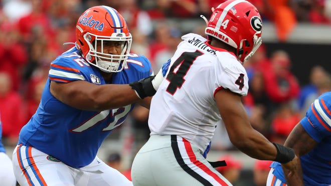 Florida offensive lineman Stone Forsythe (72) block Georgia linebacker Nolan Smith (4) during last year's game at TIAA Bank Field.