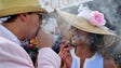 John Sell and Megan Mejia smoke cigars in their derby
