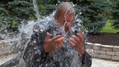 Indianapolis Colts owner Jim Irsay takes the ALS Ice Bucket Challenge from quarterback Andrew Luck.