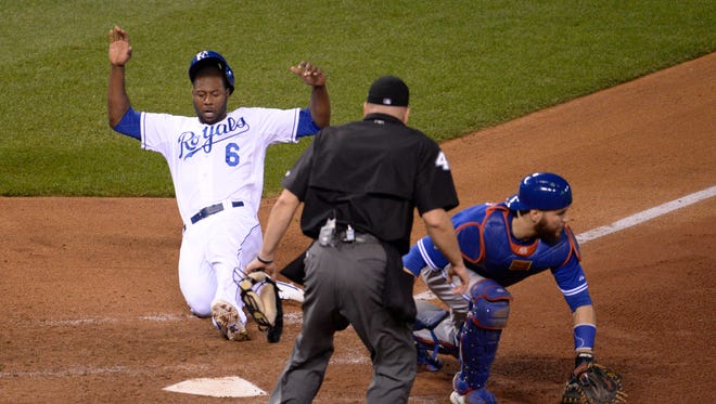 Lorenzo Cain scores on a single on a hit by Eric Hosmer in the 8th inning.