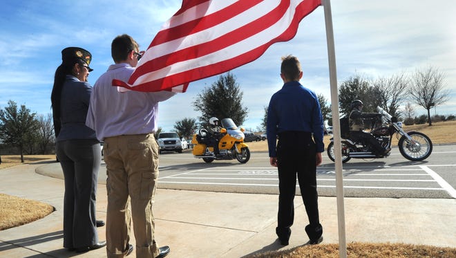 People watch the arrival of the Patriot Guard Riders at the Jan. 10 service for Vietnam veteran Charles Sorrell, who died in Odessa with no known next of kin. Sorrell was buried at Texas State Veterans Cemetery at Abilene on Jan. 10, 2017.