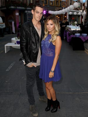 Christopher French and Ashley Tisdale in L.A. last month.