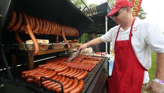 Michael Dutkowski, owner of Taste of Poland manning his smoker barbecue at New Jersey's only all New Jersey Craft Beer and Food Festival is held at Lewis Morris Park in Morristown as a fundraiser for Eleventh Hour Rescue, a Rockaway-based animal shelter. May 21, 2016. Morristown, N.J.