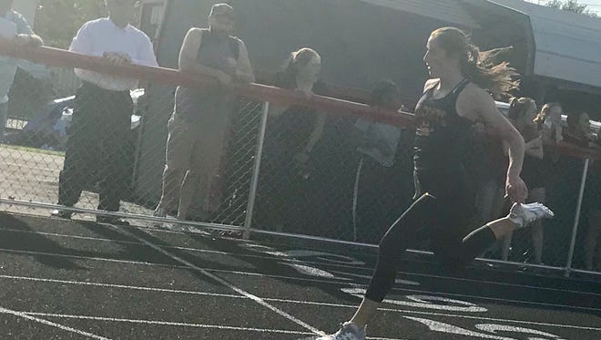 North Union senior Abby Davis completes the sprinting trifecta, winning the girls 200-meter dash during the Mid Ohio Athletic Conference Track and Field Championships at Harding Stadium Thursday. Davis also won the 100 and 400 at the meet.