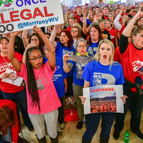 Teachers hold a rally outside the Senate Chambers...