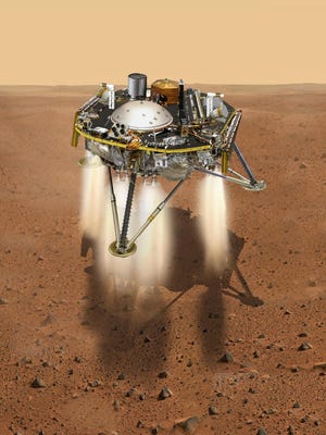 This NASA illustration shows a simulated view of the InSight lander firing retrorockets to slow down as it descends toward the surface of Mars.